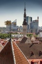 Rooftops in old town with new Tallinn behind. Royalty Free Stock Photo