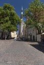 Cobbled Lai (Wide) Street and St Olaf`s church in Tallinn