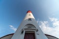 Baltic lighthouse, red white colors, bottom view. Most western russian lighthouse in Baltiysk city. Beautiful sunny weather