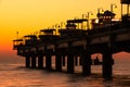 Baltic sea at beautiful sunset in Miedzyzdroje beach. Polish baltic coast. Famous city among the tourist. Pier at sunset