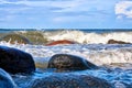 Baltic Sea with big stones and foaming waves on the shore Royalty Free Stock Photo