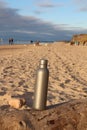 Silver water Bottle. Baltic sea in Jurkalne, Latvia. Sea fishing on coast. Sunny autumn