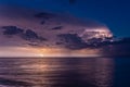 Baltic sea at night with a flash of lightning in the gloomy clouds with long exposure