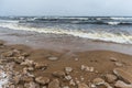 Baltic Sea snowy beach, big waves in the sea on winter