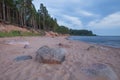 Baltic sea with waves, rocks and blue sky. Summer evening.