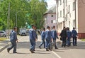 BALTIISK, RUSSIA. A group of sailors in working uniform crosses the street. Kaliningrad region