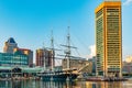 Baltimore, Maryland, US - September 4, 2019 View of Baltimore Harbor with USS Constellation Ship and office buildings Royalty Free Stock Photo