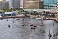 Looking Out Over the Baltimore Inner Harbor Where Tourists Ride in Pirate Themed Paddle Boats