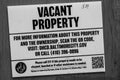 Baltimore, MD - September 25 2022: Vacant Property Sign in front of an abandoned building in Baltimore, Maryland