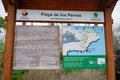 BALTRA, ECUADOR - NOVEMBER 11, 2018: Outdoor view of informative sign of los perros beach in Galapagos