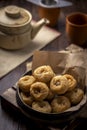 Indian traditional sweet balushahi served on a metal plate on wooden background Royalty Free Stock Photo