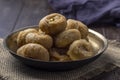 Indian traditional sweet balushahi served on a metal plate on wooden background Royalty Free Stock Photo