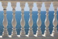 Baluster beach. White columns overlooking the sea. View of white pillars and horizont on blue sea and the sky in the Royalty Free Stock Photo