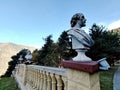 Balustrade with Classical Busts in a Mountainous Landscape. Royalty Free Stock Photo