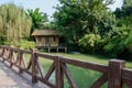 Balustrade of footbridge in verdant green on sunny day