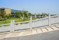 Balustraded arch bridge with tarred roadway and stone stairway o