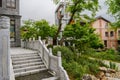 Balustraded stone stairway before old-fashioned building in cloudy afternoon Royalty Free Stock Photo