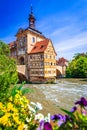 Bamberg, Bavaria - Half-timebered town hall and bridge decorated by flowers, Germany Royalty Free Stock Photo