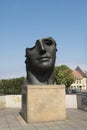 Statue Centurion I, from Igor Mitoraj on the lower bridge in Bamberg, Germany on a blue sky