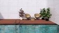 bamboo armchair and table on wooden floor swimming pool deck with small plant Royalty Free Stock Photo