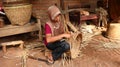 Bamboo basket craftswoman while doing his work Royalty Free Stock Photo