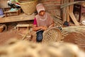 bamboo basket craftswoman while doing his work Royalty Free Stock Photo