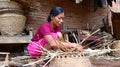 Bamboo basket craftswoman while doing his work Royalty Free Stock Photo