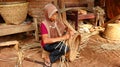 Bamboo basket craftswoman while doing his work Royalty Free Stock Photo