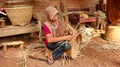 Bamboo basket craftswoman while doing his work Royalty Free Stock Photo