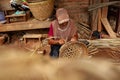 Bamboo basket craftswoman while doing his work Royalty Free Stock Photo