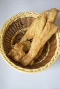 Bamboo basket and fried dough sticks Royalty Free Stock Photo