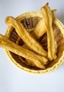 Bamboo basket and fried dough sticks Royalty Free Stock Photo