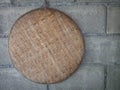 Bamboo basket hand made hanging on brick wall. Royalty Free Stock Photo