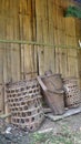 Bamboo baskets lean on latch wall Royalty Free Stock Photo