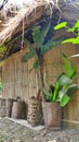 Bamboo baskets lean on latch wall Royalty Free Stock Photo