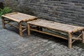 Bamboo beds against gray brick wall