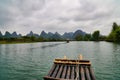 Bamboo Boat Ride On The Yulong River In Yangshuo, China Bamboo Boat Ride On The Yulong River In Yangshuo, China