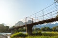 Bamboo bridge over Nam Song River at Vang Vieng village Royalty Free Stock Photo