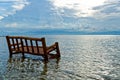 A Bamboo Chair is Soaked in the Ocean