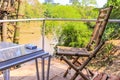 Bamboo chairs on the veranda of the hut on the background of the jungle