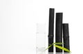 Bamboo charcoal water filter sticks, green leaf and glass of water. Natural bamboo charcoal is a powerful purifier which refreshes Royalty Free Stock Photo