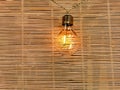 Bamboo curtain near with an electric lamp turned on, signal attention, attention,attention, copy space