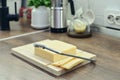 Bamboo cutting board with a built-in cheese cutting device Royalty Free Stock Photo