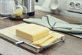 Bamboo cutting board with a built-in cheese cutting device Royalty Free Stock Photo