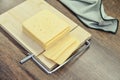 Bamboo cutting board with a built-in cheese cutting device Royalty Free Stock Photo
