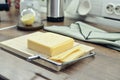 Bamboo cutting board with a built-in cheese cutting device Royalty Free Stock Photo