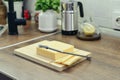 Bamboo cutting board with a built-in cheese cutting device Royalty Free Stock Photo