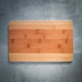 Bamboo cutting Board on grey background. Top view Royalty Free Stock Photo