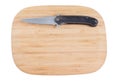 Bamboo cutting board with a knife. Royalty Free Stock Photo