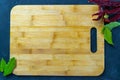 Bamboo cutting Board, pepper and Bay leaf nearby Royalty Free Stock Photo